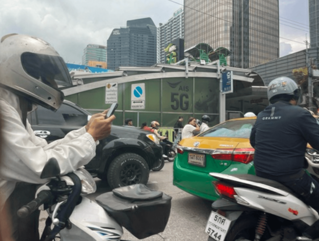 In downtown Bangkok (around 11amon weekdays), cars don't move in traffic jams so much that there is time to fiddle with your phone.